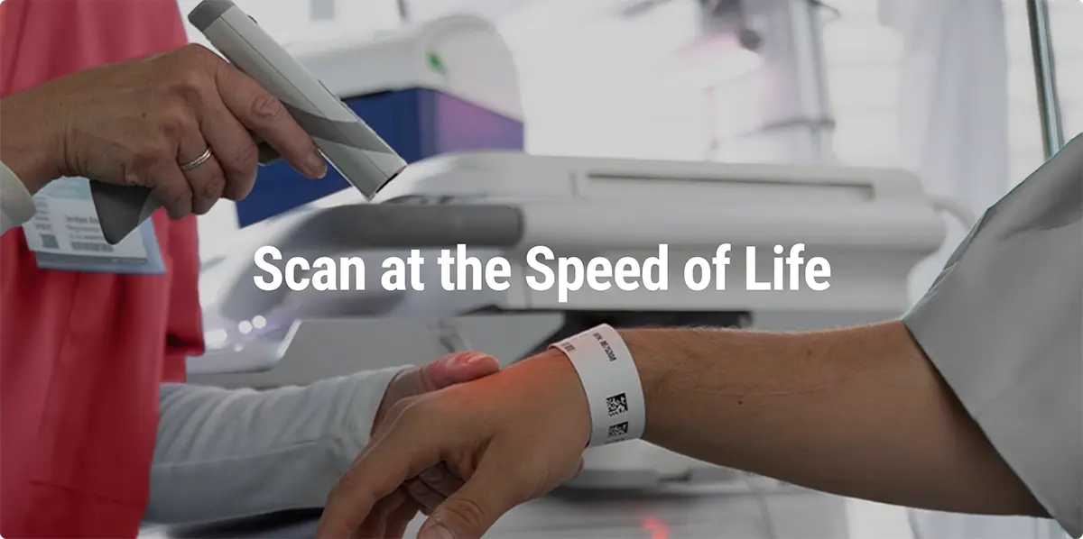 Nurse scanning patient wristband for medication
